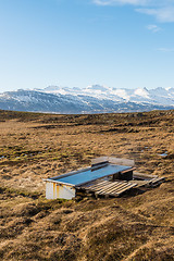 Image showing Icelandic hotpot among the amazing lagoon and mountains