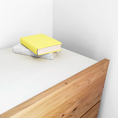 Image showing Books on a wooden dresser