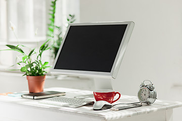 Image showing Stylish workspace with computer on home or studio