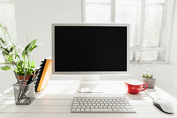 Image showing Stylish workspace with computer on home or studio