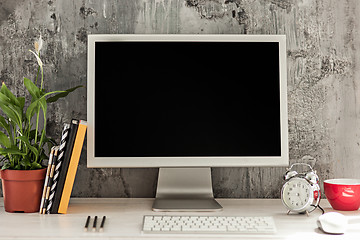 Image showing Stylish workspace with computer on home or studio