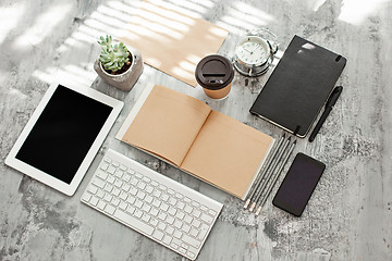 Image showing Office desk table with computer, supplies and phone