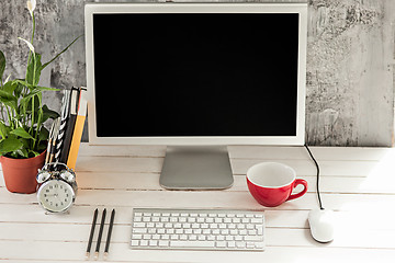 Image showing Stylish workspace with computer at home or studio