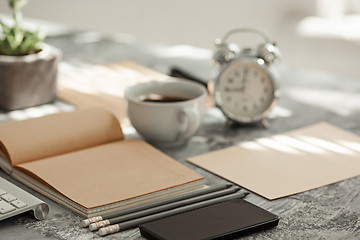 Image showing Office desk table with computer, supplies and phone