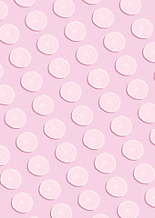 Image showing The lemon pattern on pink background. Minimal concept.