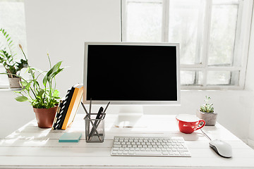 Image showing Stylish workspace with computer at home or studio