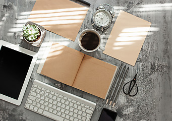 Image showing Office desk table with computer, supplies and phone