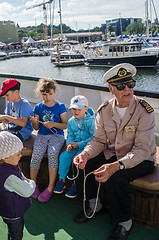 Image showing Experienced sailor shows how to knit knots at the Days of the Sea in Tallinn