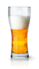 Image showing Half glass of light beer with foam