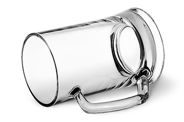 Image showing Big glass beer mug lying down