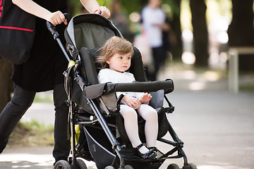 Image showing baby girl sitting in the pram