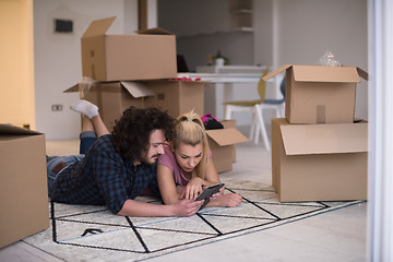 Image showing Young couple moving in a new flat