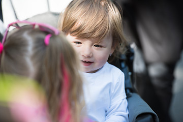 Image showing baby girl sitting in the pram