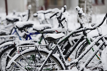 Image showing bikes covered with a blanket of snow