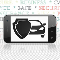 Image showing Insurance concept: Smartphone with Car And Shield on display