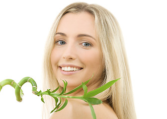 Image showing happy blonde with bamboo