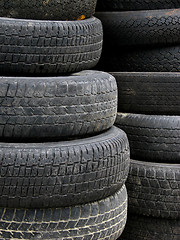 Image showing Old useless tires stacked up