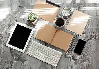 Image showing Office desk table with computer, supplies and phone