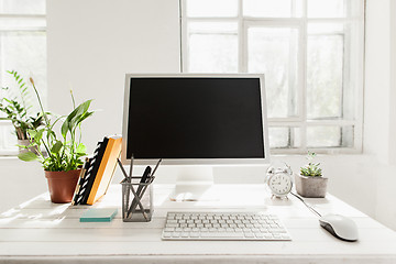 Image showing Stylish workspace with computer at home or studio