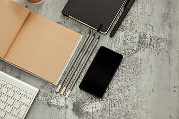 Image showing Office desk table with computer, supplies and phone