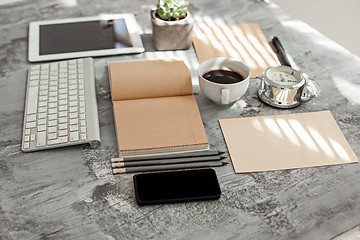 Image showing Office desk table with computer, supplies and phone