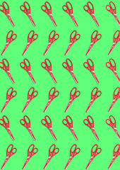 Image showing top view of a many red colored plastic scissors on green background