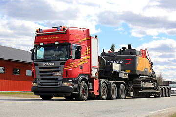 Image showing Red Scania Semi Trailer Hauls Hydraulic Excavator