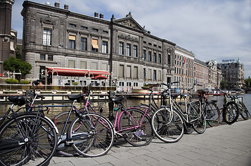 Image showing bicycles on canal amsterdam holland