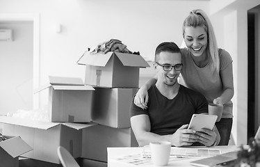 Image showing Young couple moving in a new home