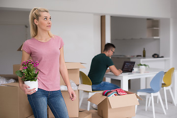 Image showing young couple moving into a new home