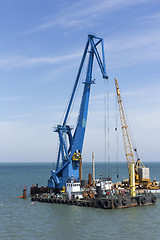 Image showing crane barge doing marine heavy lift installation works in the gulf or the sea