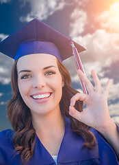 Image showing Happy Graduating Mixed Race Woman In Cap and Gown