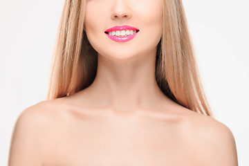 Image showing The sensual red lips, mouth open, white teeth.