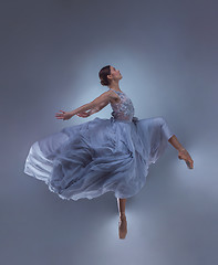 Image showing The beautiful ballerina dancing in blue long dress 