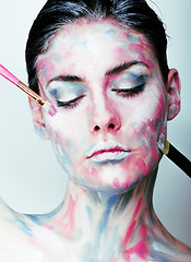 Image showing young woman with creative make up like painted oil picture on fa