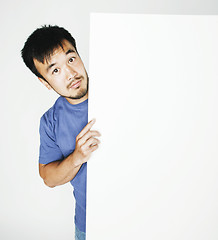 Image showing pretty cool asian man holding empty white plate smiling