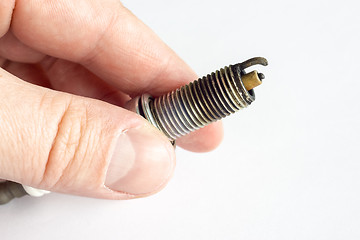 Image showing Broken spark plug in hand