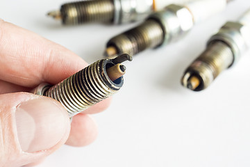 Image showing Replacing damaged spark plugs for cars