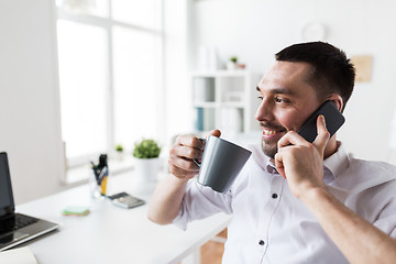 Image showing businessman calling on smartphone at office