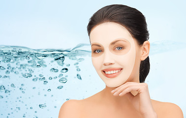 Image showing beautiful young woman with collagen facial mask