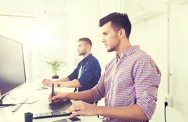 Image showing man or designer with computer and tablet at office