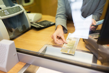 Image showing clerk counting cash money at bank office