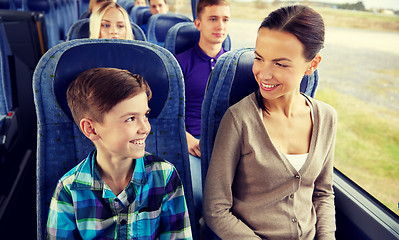 Image showing happy family riding in travel bus