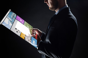 Image showing close up of businessman with transparent tablet pc