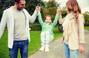 Image showing happy family walking in summer park and having fun