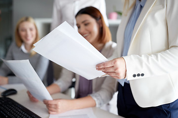 Image showing businesswomen with papers in office