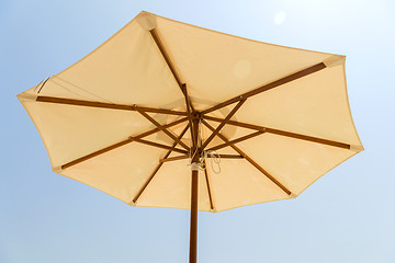 Image showing parasol over blue sky