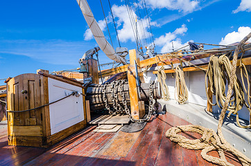 Image showing The ship\'s bell and the anchor lift mechanism on the sailboat