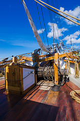 Image showing The ship\'s bell and the anchor lift mechanism on the sailboat