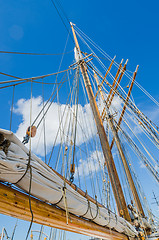 Image showing Folded sail and mast on an old sailboat